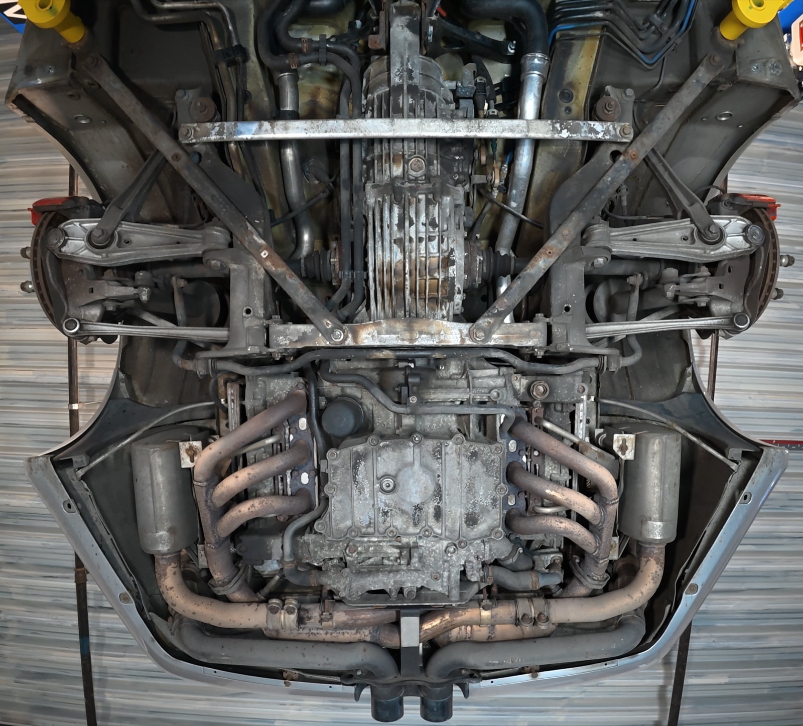 Porsche 911 underbody before treatment — contamination and deposits